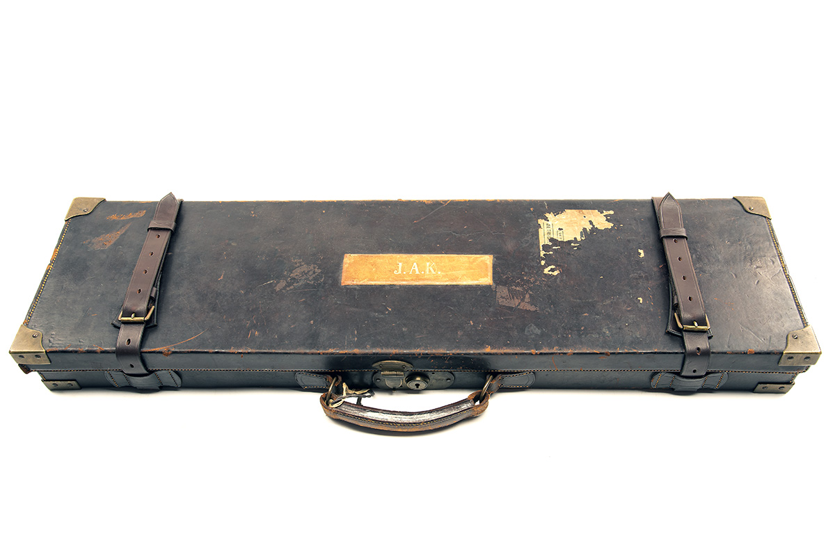 A BRASS-CORNERED LEATHER SINGLE GUNCASE, fitted for 30in. barrels, the interior lined with red - Image 2 of 2