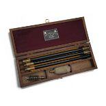 JAMES PURDEY & SONS A 12-BORE GUN CLEANING KIT, comprising of a three-piece brass and nylon cleaning