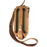 A LOADMASTER LEATHER FAST-LOADING CARTRIDGE HOLDER, with canvas and leather shoulder strap, the
