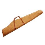 A LEATHER BUFFALO HIDE SINGLE PADDED RIFLE SLIP, with leather carry handle, measuring approx. 50in..