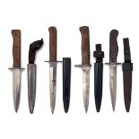 FOUR GERMAN WORLD WAR ONE AND TWO TRENCH-KNIVES, all different and including a World War one example