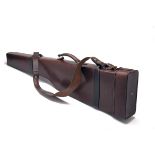 A LEATHER 4-BORE TAKE-DOWN GUNCASE, fitted for 44in. barrels, leather shoulder strap and brass