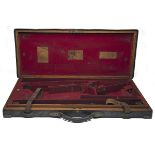 JAMES PURDEY & SONS A BRASS-CORNERED OAK AND LEATHER DOUBLE GUNCASE, fitted for 29in. barrels, the