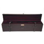 AN UNUSED LEATHER DOUBLE UNIVERSAL GUNCASE, fitted for 31in. barrels, the interior lined with maroon