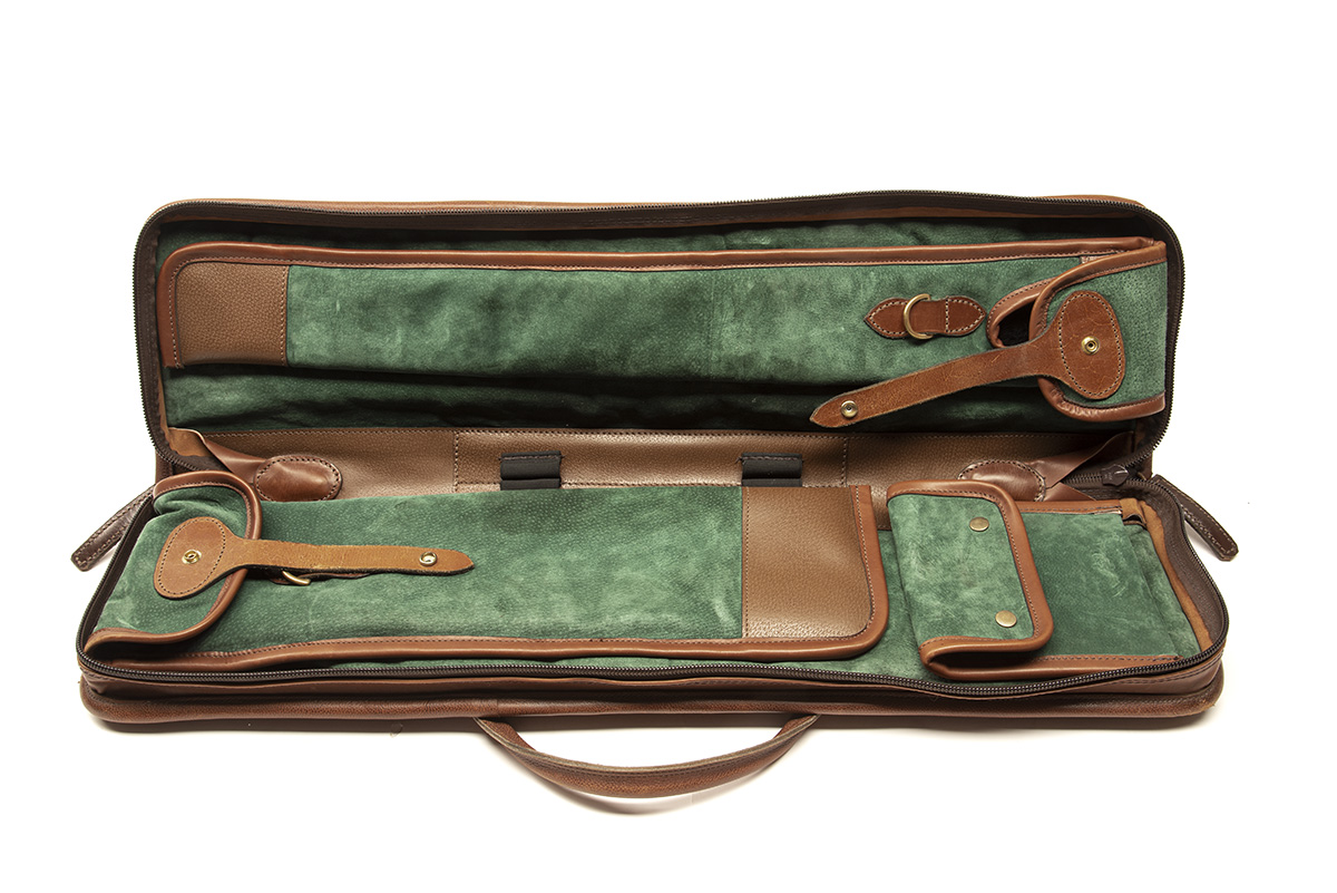 A FINE TAKE-DOWN SOFT LEATHER SUEDE-LINED GUNCASE, fitted for 30in. barrels, the interior lined with