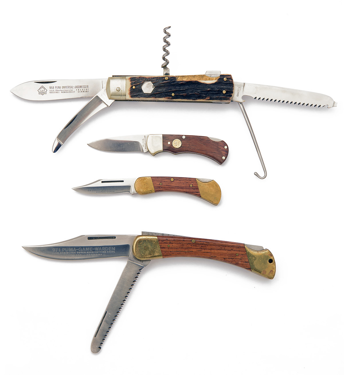 PUMA, SOLINGEN A GROUP OF FOUR FOLDING KNIVES, including a Model 700 lock-knife serial no. 44882