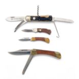 PUMA, SOLINGEN A GROUP OF FOUR FOLDING KNIVES, including a Model 700 lock-knife serial no. 44882