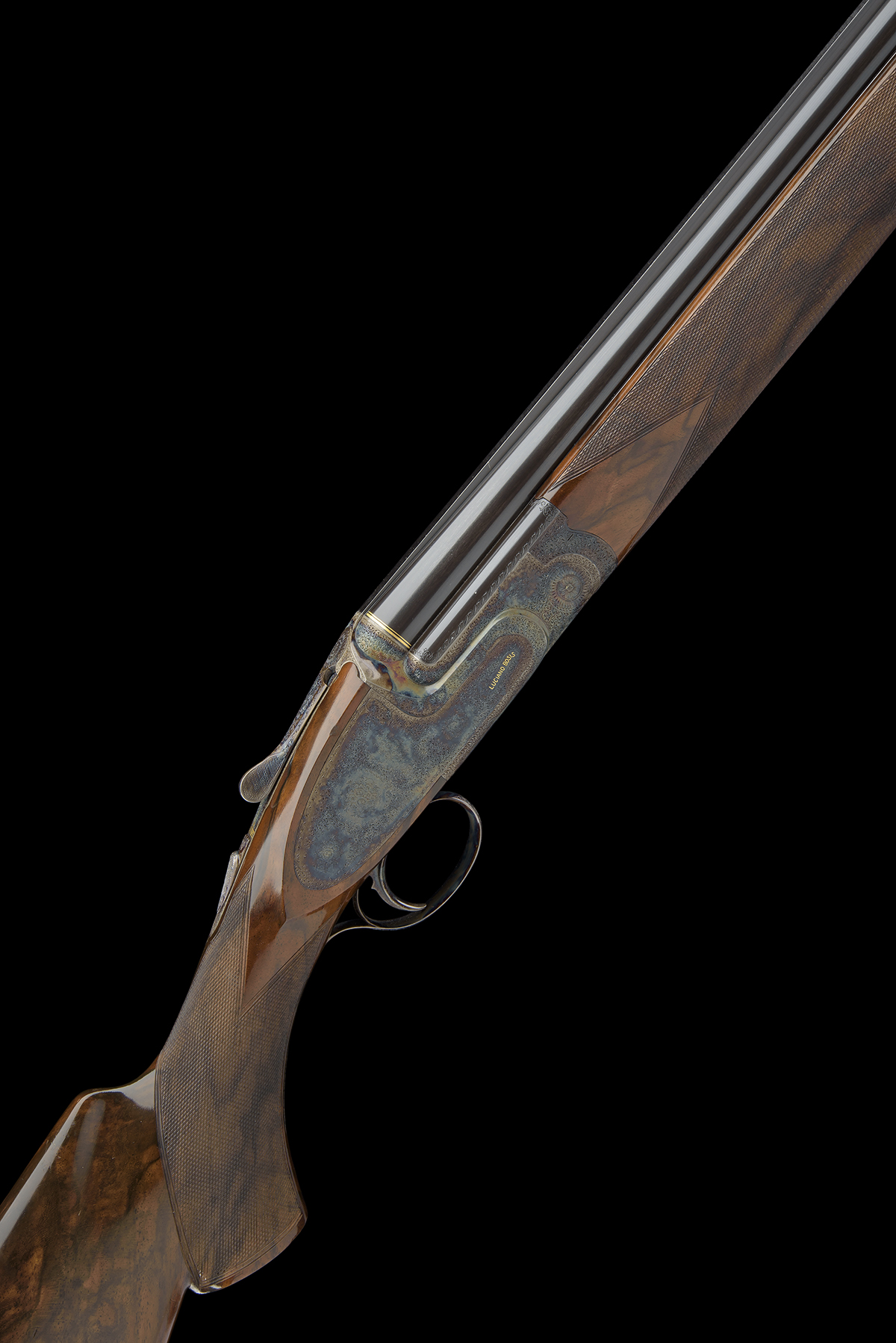 LUCIANO BOSIS A FINE PEDRETTI-ENGRAVED 12-BORE 'MICHELANGELO' SINGLE-TRIGGER OVER AND UNDER