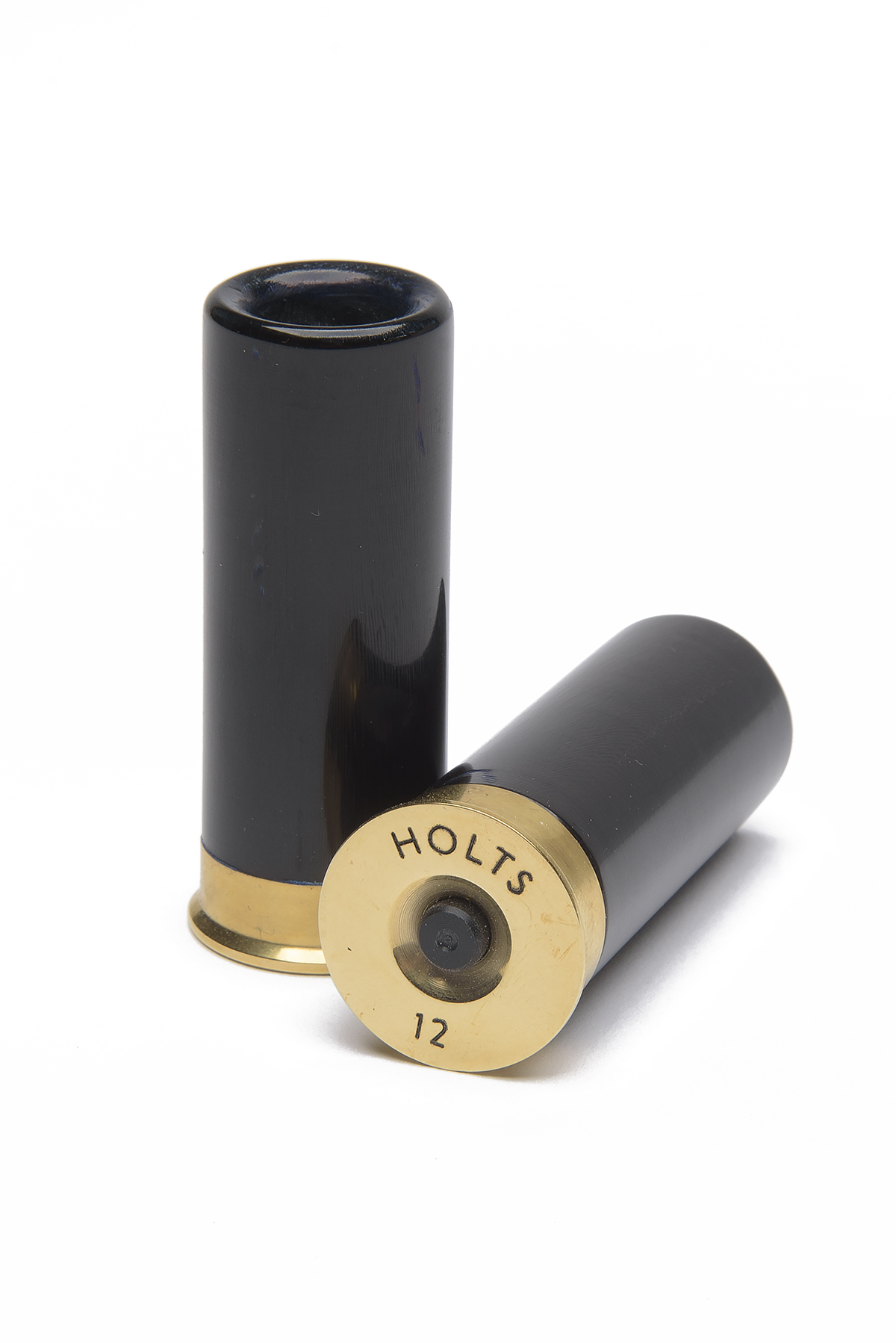 A SET OF BRASS AND BUFFALO HORN 12-BORE SNAP CAPS, signed 'HOLTS'.