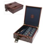REY PAVON A NEW AND UNUSED LEATHER CASED SET OF TEN SHOT GLASSES, with provision for a bottle of