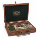 PENDLETON ROYAL A TAN LEATHER 'WINDSOR' 12-BORE GUN CLEANING KIT, with a lined oak tray containing a