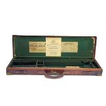 WESTLEY RICHARDS & CO. A BRASS-CORNERED LEATHER SINGLE GUNCASE, fitted for 30in. barrels, the