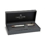 CARAN D'ACHE, SWITZERLAND A BOXED 'WHITE & ROSE-GOLD' FINISHED SLIMLINE BALLPOINT PEN, MODEL '