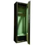 A GLASS-FRONTED GUN CABINET fitted for eleven full-length guns, the interior lined with green baize,