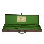 A CANVAS AND LEATHER SINGLE HAMMERGUN CASE, fitted for 31in. barrels, the interior re-lined with