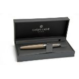 CARAN D'ACHE, SWITZERLAND A BOXED 'CASHMERE' BI-COLOUR FINISHED ROLLERBALL PEN, MODEL 'LEMAN', ref