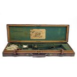 E. & G. HIGHAM A BRASS-CORNERED OAK AND LEATHER SINGLE HAMMERGUN CASE, fitted for 30in. barrels, the