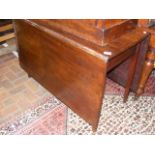 An antique mahogany drop leaf table - 160cm x 107c