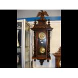 An antique wall clock, eagle surmount - 100cms