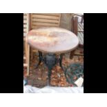 A cast iron pub table with wooden top