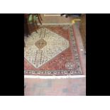 A Middle Eastern style rug with geometric border -