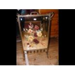 A Victorian mirrored back brass fire screen