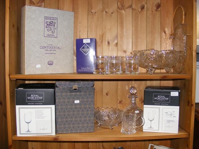 Two shelves of cut glass ware including decanter