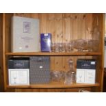 Two shelves of cut glass ware including decanter