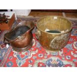 A brass coal bucket together with copper coal helm