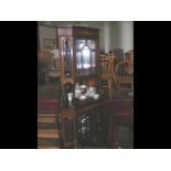 An Edwardian inlaid corner display cabinet