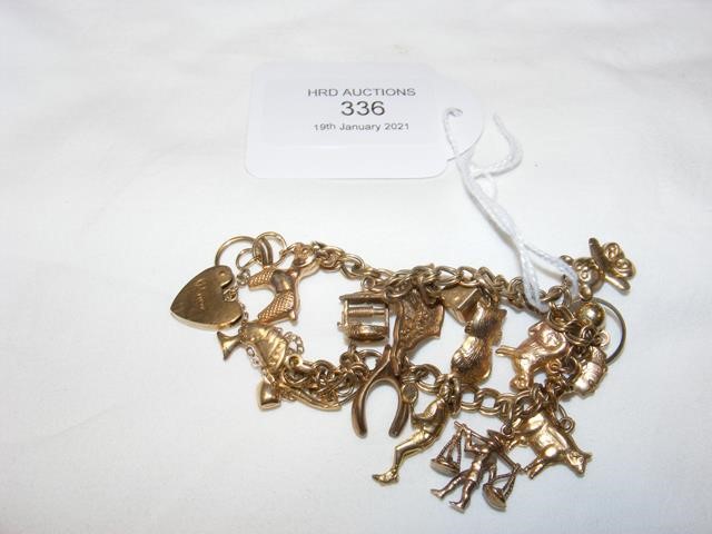 A 9 carat gold charm bracelet