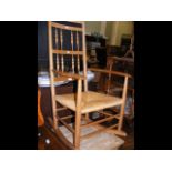 A spindle back rocking chair with rush seat