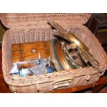 A wicker basket containing jewellery box, mirror e