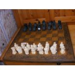 An unusual chess set with board