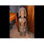 A 95cm carved African female figure