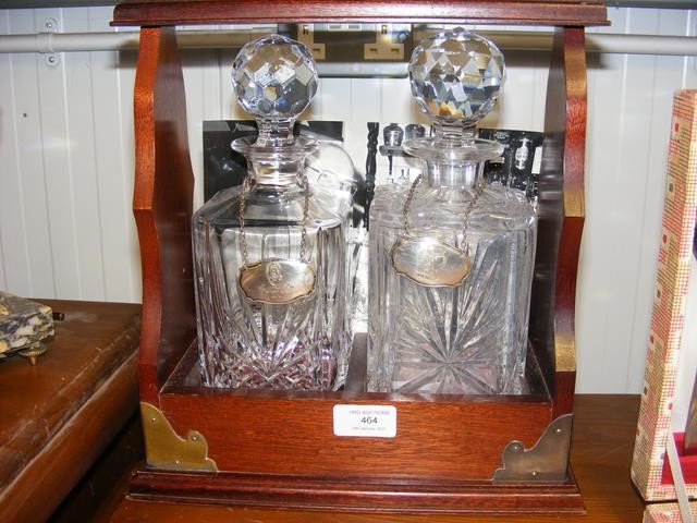 Two bottle cut glass decanters with silver labels