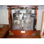 Two bottle cut glass decanters with silver labels