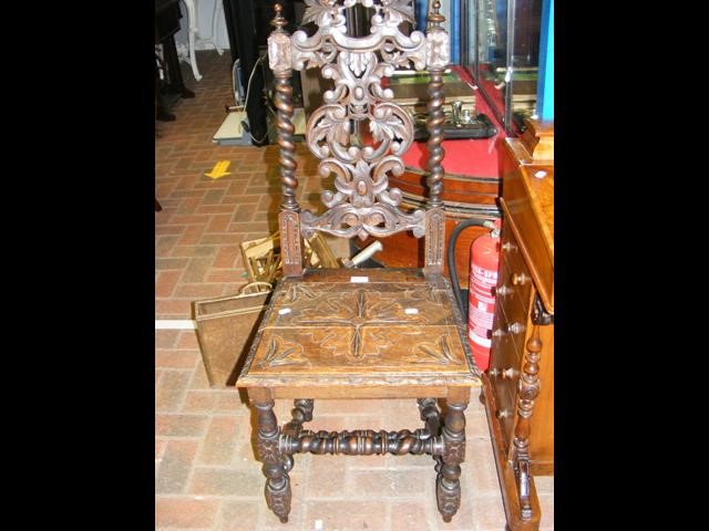 A Victorian oak hall chair