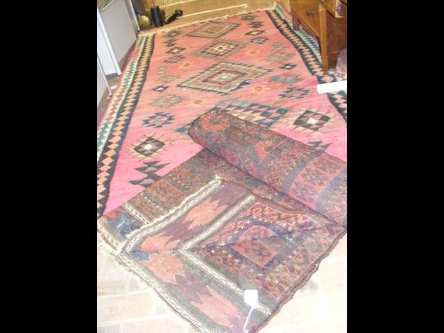 An antique rug with geometric centre medallion - 2