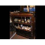 An antique oak open bookcase