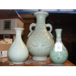 A celadon style Oriental vase together with two ot