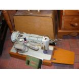 A Singer sewing machine in original carrying case,