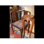 An Edwardian corner chair together with a plant st