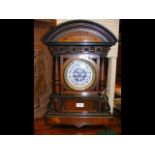An antique striking mantel clock - 54cms high