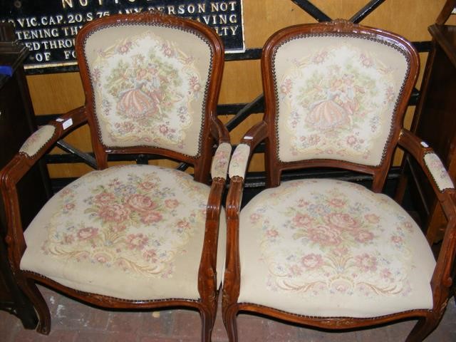 A pair of French style armchairs