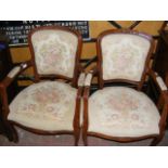 A pair of French style armchairs