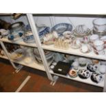 Four shelves of collectable ceramicware including