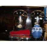 A pair of Oriental style vase, ginger jar and cove