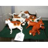 A selection of Beswick fox and hound ornaments