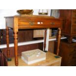 An antique side table with single drawer